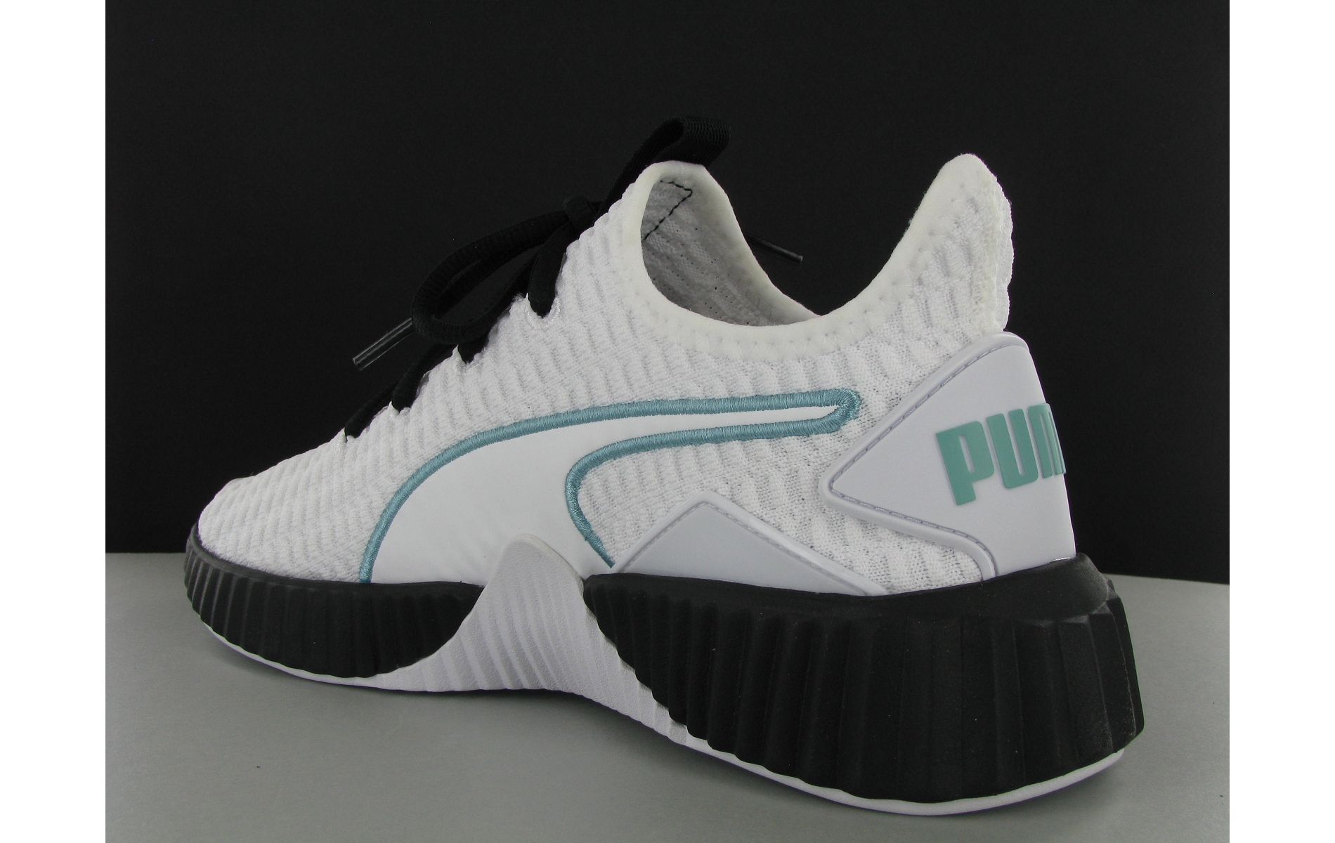 puma defy sneakers in white